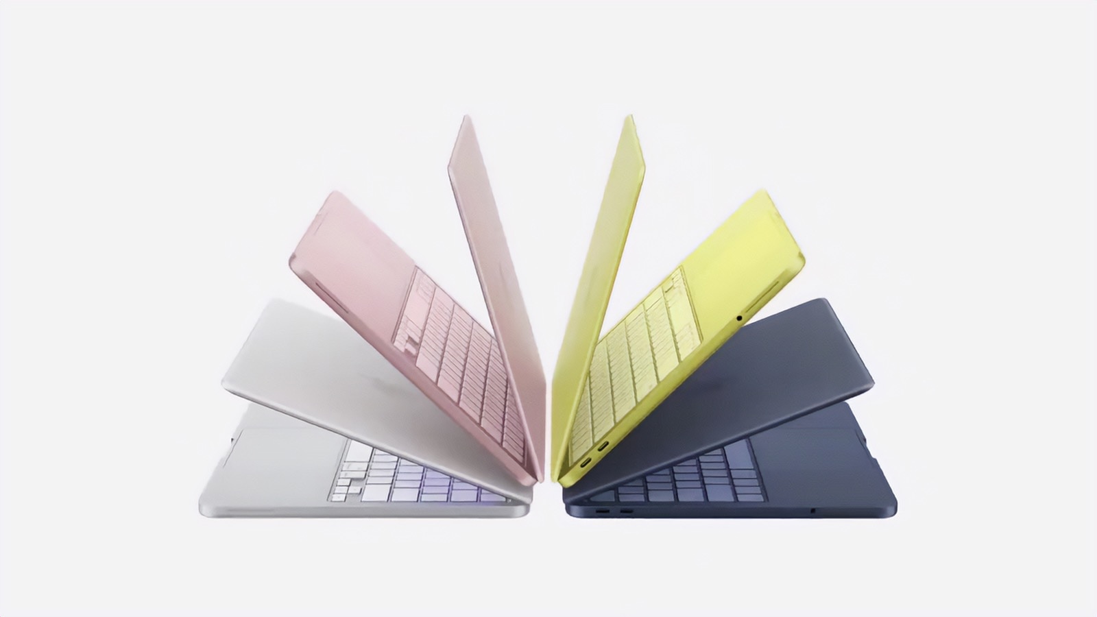 Fyra MacBook Neo i silver, rosé, citrus och indigo uppställda i solfjäder